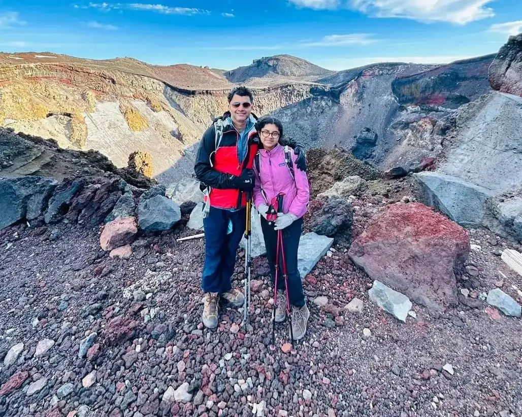 Ananya and her dad at the crater rim near the summit of Mount Fuji
